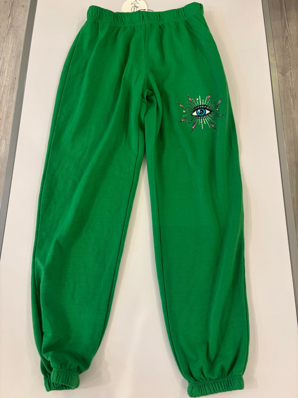 Kids Green Joggers with Embroidered Eye Accent